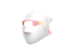 White Megelin LASER & LED mask and remote on grey surface.
