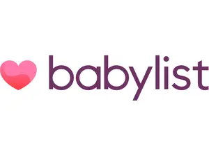 A woman enjoys a baby registry gift with her friends.
