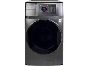 An LG washer-dryer combo in the Reviewed testing lab in front of a wall of copper pipes.
