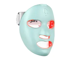 Three red light LED therapy masks on a pink background