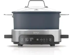 Three of the best slow cookers we tested (Cuisinart, Hamilton Beach, and GreenPan) are displayed on a kitchen counter.