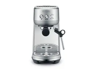Breville Bambino espresso maker on brown paper-like background