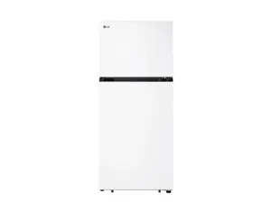 Three different refrigerators standing against a brick wall