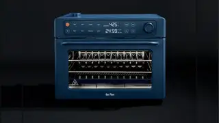 Wonder Oven Pro toaster oven on a black background