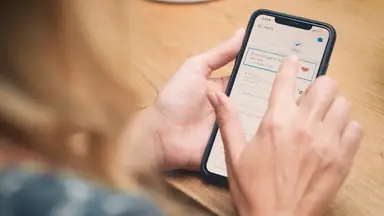A person's hands holding a smartphone