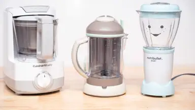 Three different baby food makers sit on a kitchen counter.
