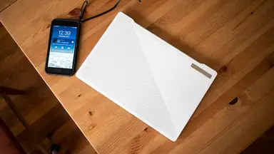 An overview shot of the Zephyrus G14 showcasing its matte white lid and AniMe LED display