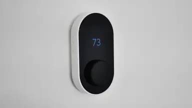 Wyze Thermostat against white wall