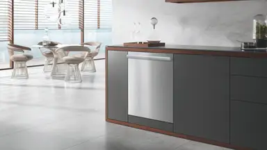 an upscale kitchen with a sleek dishwasher installed in cabinetry
