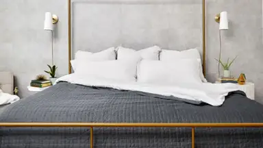 The Cooling Gravity Weighted Blanket on a bed