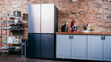 A sleek French-door fridge is standing in a kitchen