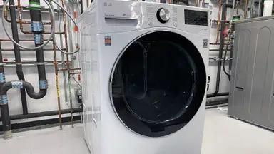 A white LG WM4200HWA sits in an industrial lab.