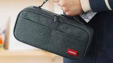 A student bringing their pen and pencil case to class.