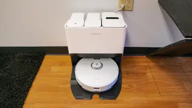 The Roborock S8 Pro Ultra in its dock on top of hardwood surface.