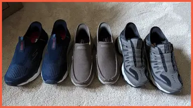 Three different pairs of the Sketcher Slip-Ins on carpet.