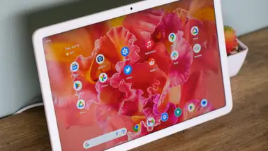 Google's Pixel Tablet , mounted on its dock, sits on a side table in our tester's home