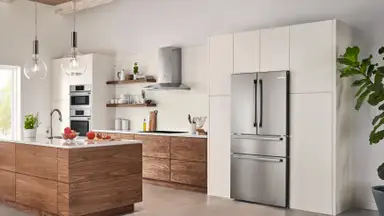 Modern kitchen with stainless steel fridge