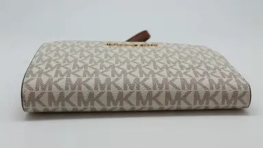 A women's leather wallet by Michael Kors.