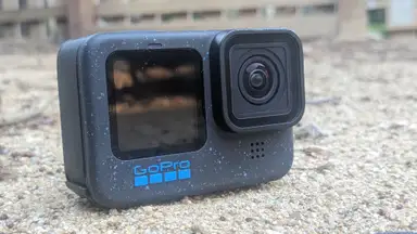 The GoPro Hero12 Black laying on the ground in an outdoor setting.
