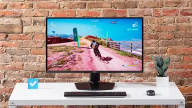 The MSI MPG 321URX gaming monitor on a white desktop.