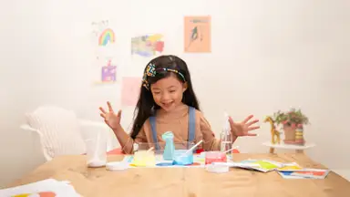 Kid engaged in a chemistry-inspired activity featuring colorful mixtures, measuring tools, and experiment instructions, promoting curiosity and hands-on learning.