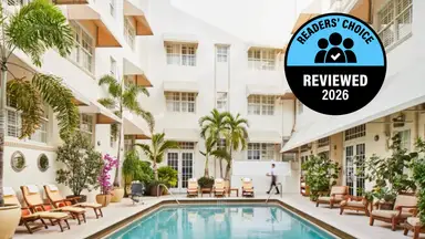 A hotel pool area in a tropical location, like Miami