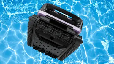 A pool robot vacuum floats in crystal clear pool water