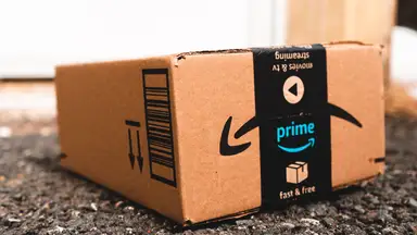 Amazon Prime box sitting in the dirt