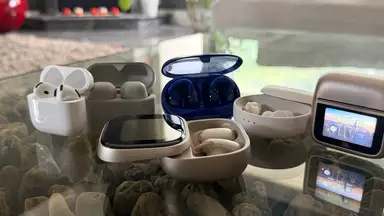 A grouping of wireless earbuds on a table