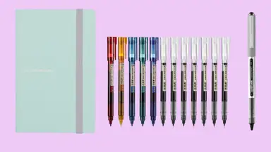 A mint-green notebook on the left is pictured with a variety of colorful Japanese pens.