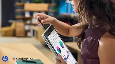 Woman holding a folded HP EliteBook X Flip with an HP and Copilot+ PC logo in the corner