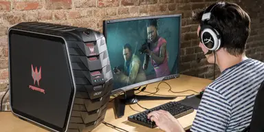 A gamer sits at his battle station playing a great game, on the best gaming hardware