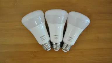 Three Philips Hue bulbs on table