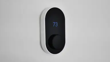 Wyze Thermostat against white wall