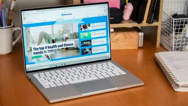 The laptop is on a desk, its bright screen the focus of the image.