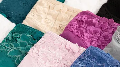 A bunch of lace women's underwear in different colors.
