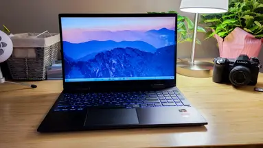 Photo of the HP Envy x360 laptop on a desk.