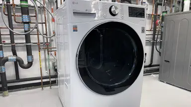 A white LG WM4200HWA sits in an industrial lab.