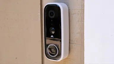 Abode Wireless Video Doorbell mounted on outside of home.