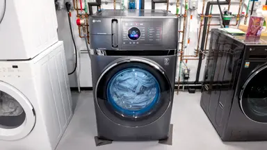 The GE PFQ97HSPVDS Washer sits in a lab environment