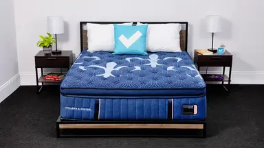 The Stearns & Foster  Lux Estate Pillow Top mattress in a bedroom between two bedside tables.