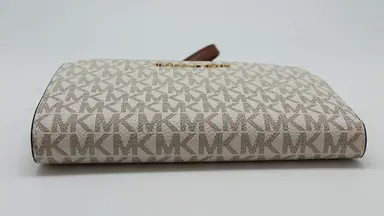 A women's leather wallet by Michael Kors.