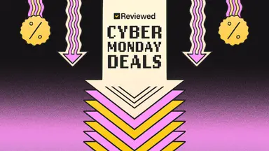 An illustration of a large down arrow on a black and pink background with the words Reviewed Cyber Monday Deals at the center and discount symbols on the sides.