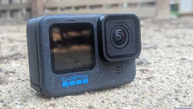 The GoPro Hero12 Black laying on the ground in an outdoor setting.
