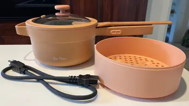 The Perfect Power Pot with its own beechwood spatula and steamer basket.
