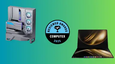 A desktop computer and a laptop sit on a green background with a round blue award badge in the center