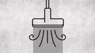 A graphic of a vacuum sucking up a rug