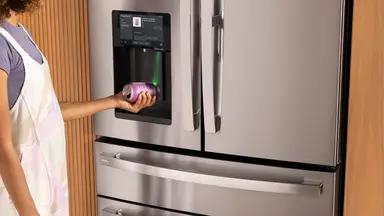 Person scans a barcode from a home refrigerator
