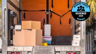 Reviewed's Readers' Choice Award nominee badge on top of an image of the open back of a moving van