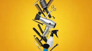 Hair styling tools and accessories against a yellow background